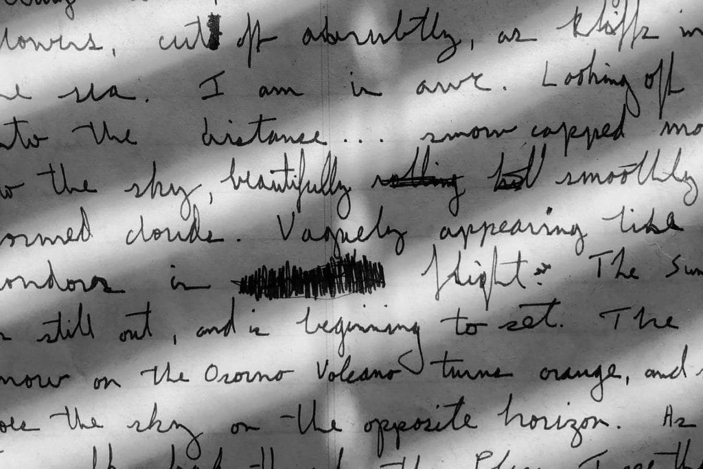 Close-up of handwritten notes with visible edits and cross-outs.