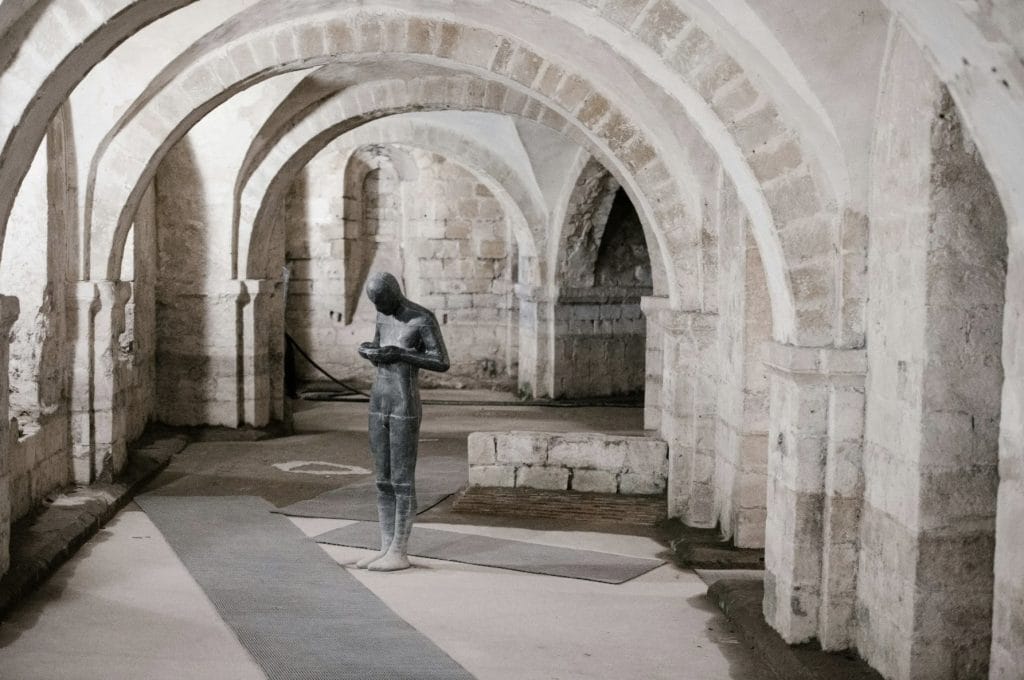 Statue Under Arches